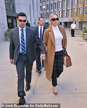 Matthew Nilo and Laura Griffin leave a courtroom in Massachusetts