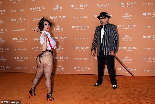 Matching: The bombshell shone next to her husband and rapper Ice-T – who donned a typical 1920s gangster ensemble