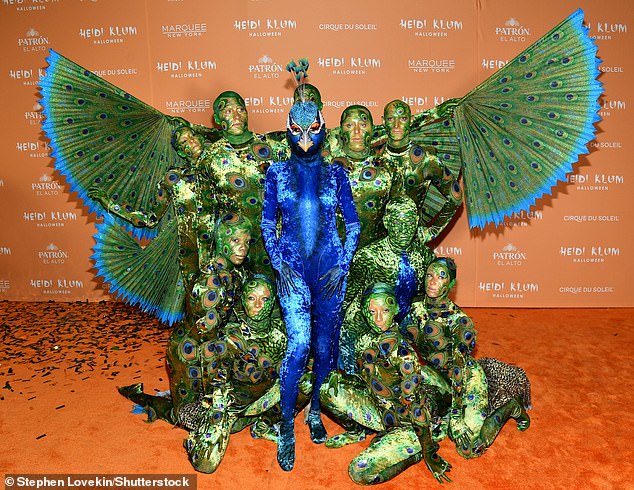 Wow!  Elsewhere, host Heidi transformed into a beautiful blue peacock, while an entourage of 10 included her green tail feathers