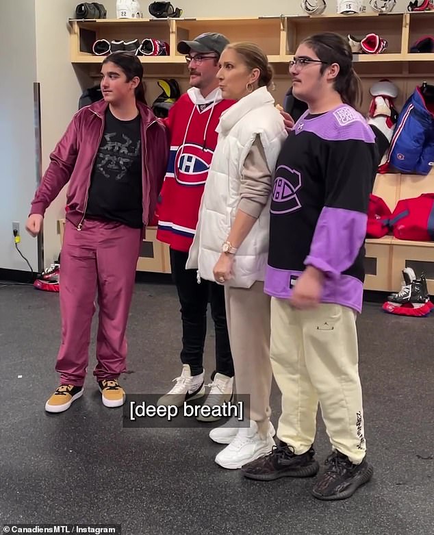 Family affair: Celine was accompanied by her sons René-Charles and twins Nelson and Eddy, and the family posed with some athletes after the race