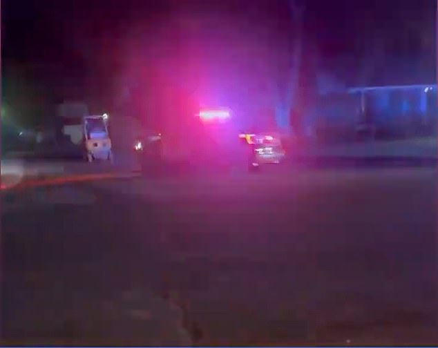 A police car follows the forklift at a snail's pace during the low-speed chase late Sunday and early Monday