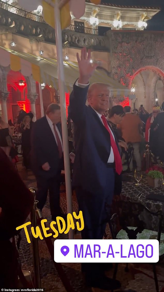 Viktor Knavs and Amalija Knavs are seen behind Donald Trump as they go to their table