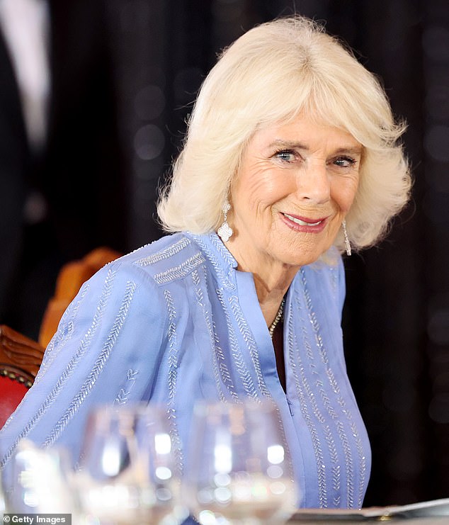 Queen Camilla smiles as she attends the state banquet hosted by President Ruto at the State House