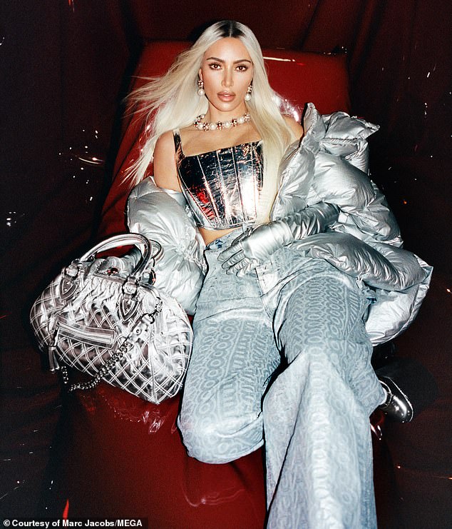 Dressed to the nines: Kardashian is seen here in a silver bustier with matching jacket, gloves and bag