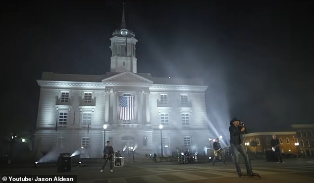 When Aldean wasn't showing footage of BLM protests, the divisive music video featured him singing in front of a large white building