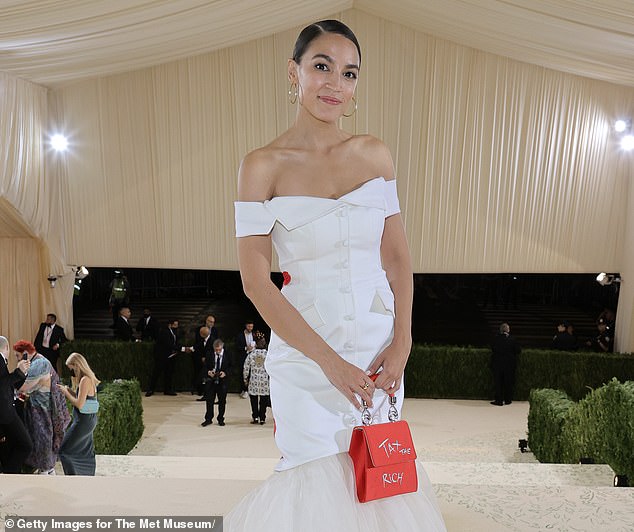 AOC even carried a red bag (pictured) to the event, which also said 