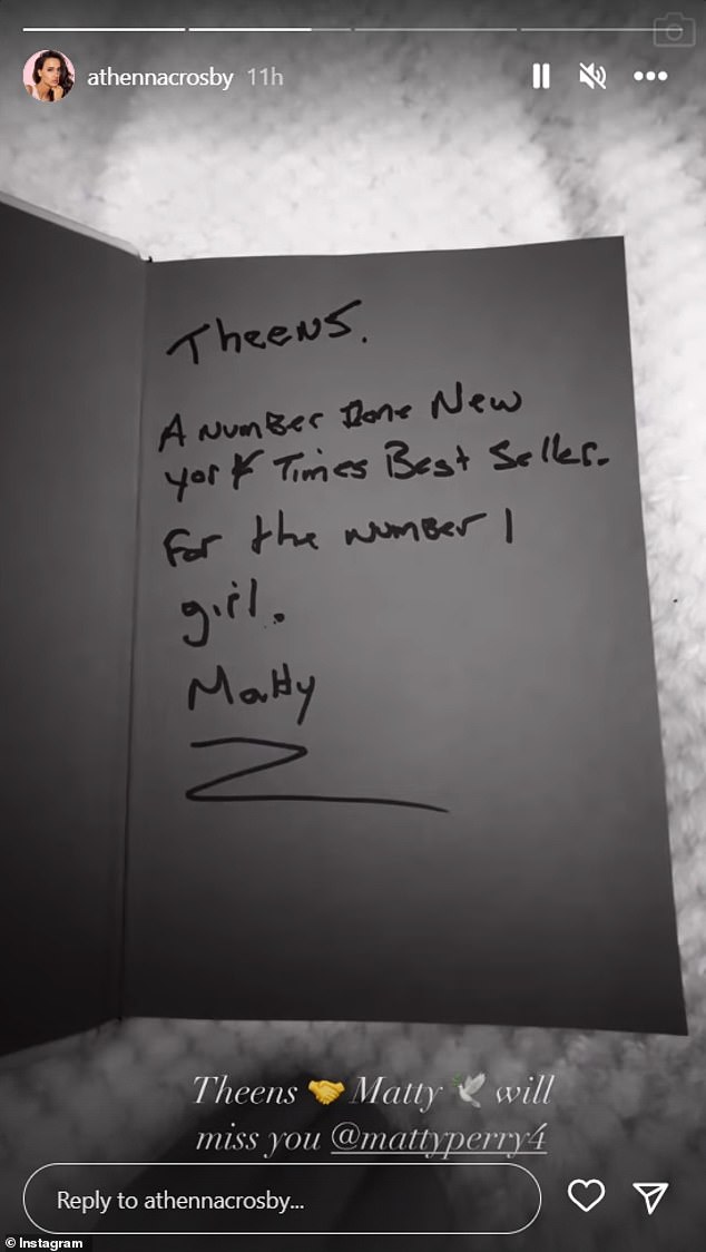 Crosby also shared a short video of her opening a copy of Perry's memoir that he had signed