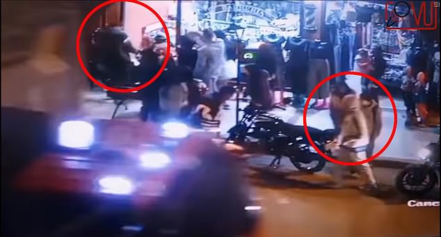 The gunman (right circle) had followed Yeferson González (left circle) before shooting and killing him in front of his daughter, whom he had accompanied on a trick-or-treating outing in Soacha, Colombia, on Tuesday evening.