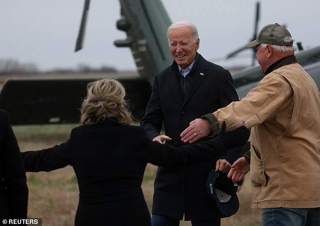 US President Joe Biden is welcomed by Minnesota Governor Tim Walz and Gwen Walz, first lady of Minnesota, upon his arrival in Northfield, Minnesota, US, November 1, 2023