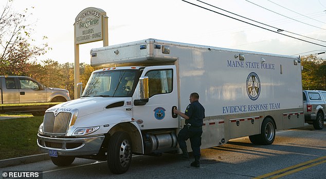 Maine State Police, seen here at the scene of the first shooting, led the manhunt for Robert Card