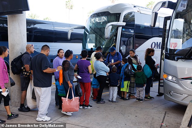 Migrants board a bus to Houston from the McAllen bus station near the Texas border