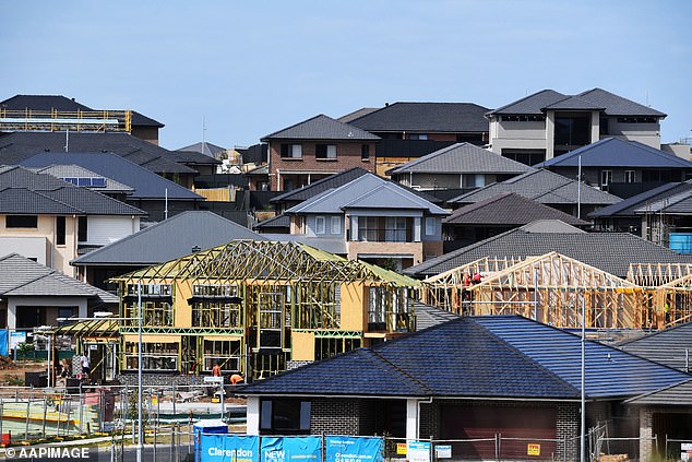 Rapid population growth has also coincided with a decline in new home completions and building permits (pictured are houses under construction in Oran Park in Sydney's far south west)