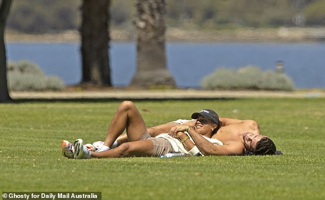 Fowler and Cleary lay together in a park in Perth and soaked up the sun
