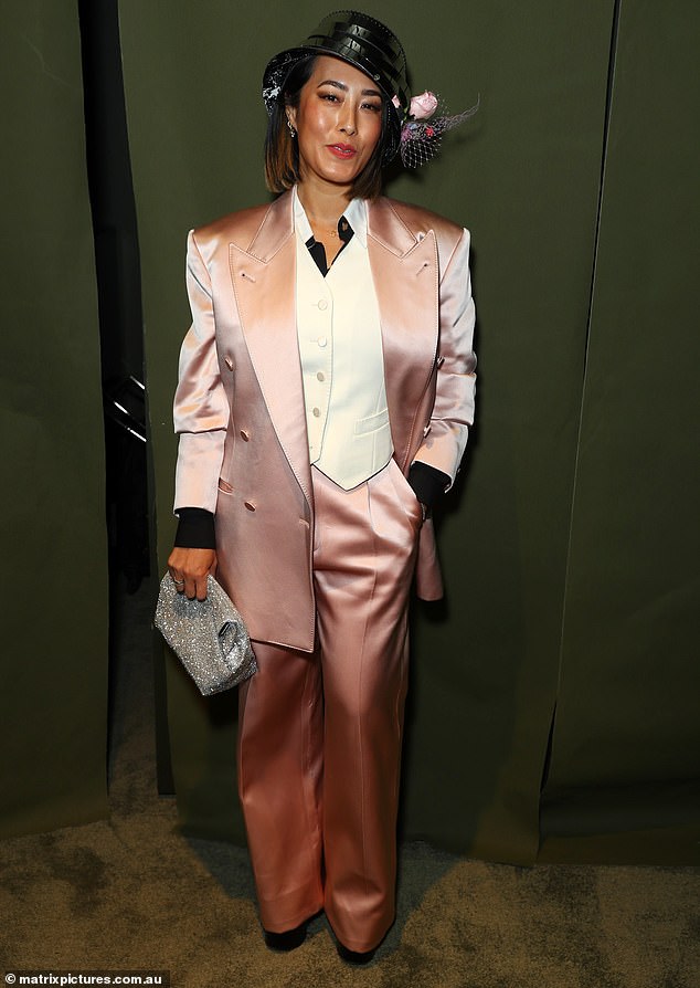 Melissa Leong made an early run as the worst dressed with this satin suit that she paired with a patent leather hat