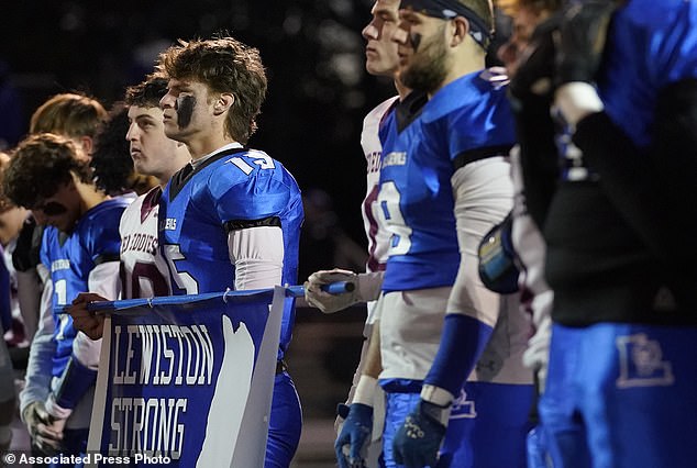 Players from Lewiston High School and Edward Little High School line up together for kickoff