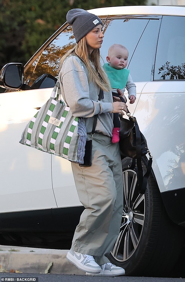 Relaxed look: The 37-year-old acclaimed actress – who dressed her seven-month-old in five Halloween costumes – wore a gray beanie over her dirty blonde locks