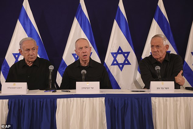 Israeli Prime Minister Benjamin Netanyahu, Defense Minister Yoav Gallant and Cabinet Minister Benny Gantz speak during a press conference at the Kirya military base in Tel Aviv