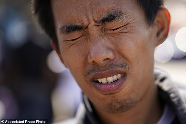 Deng Guangsen shudders as he recounts his journey from his home country of China to crossing the United States border with Mexico while sitting in a transit center in San Diego last month