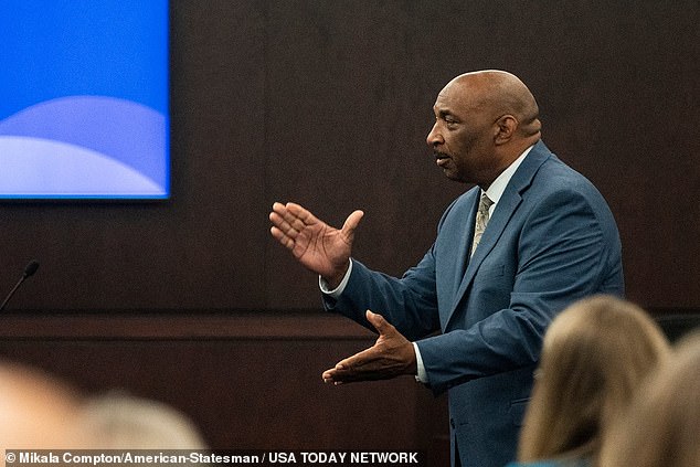 Texas Attorney Rickey Jones claps his hands to imitate the sound of a gunshot as he delivers opening arguments during the first day of the Texas trial of Kaitlin Armstrong