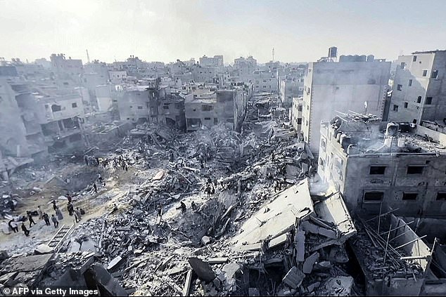 A still image from video footage shows Palestinians checking the destruction in the aftermath of an Israeli attack on the Jabalya refugee camp in the Gaza Strip on Wednesday.  Dozens of people have been killed, according to the Palestinian Ministry of Health