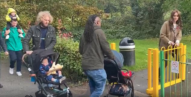 One dad (middle) commented: 'Beautiful, thank you very much,' following Kate's charming move to hold the fence