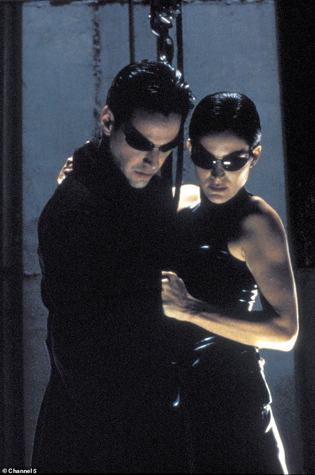 Movie Magic: Directed by The Wachowskis, the Matrix franchise follows Neo (Keanu Reeves, left) who discovers he is trapped in a simulated reality (pictured with co-star Carrie-Ann Moss)