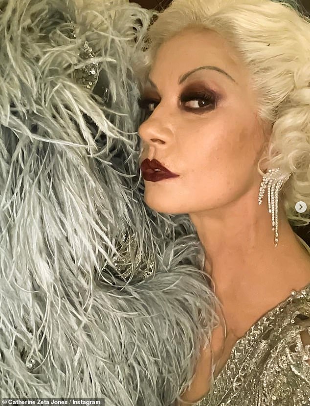 Different look: For her costume, Catherine, 54, ditched her signature dark locks for a platinum blonde wig, which was styled in a short, curly bob as she channeled Jean Harlow