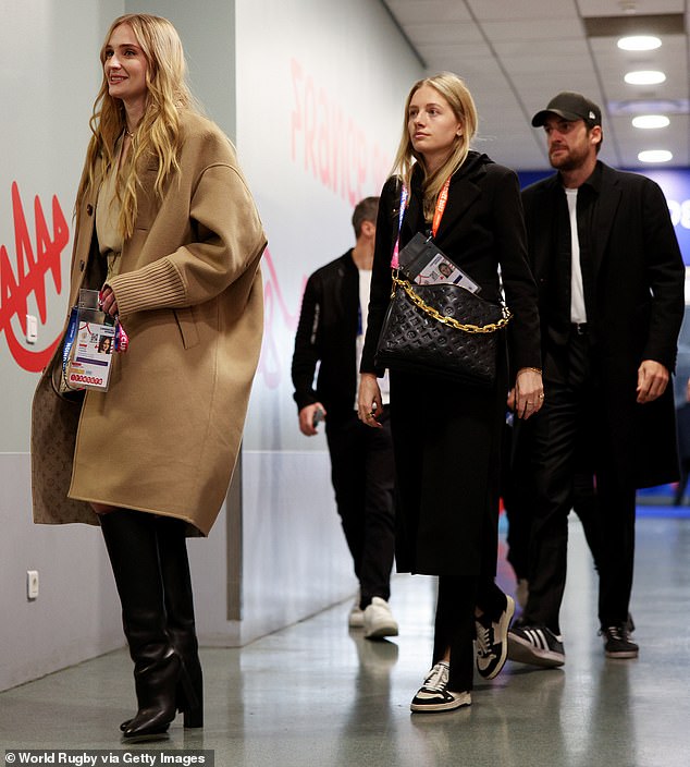 Outing: Just hours after the kiss, Sophie was seen smiling as she and Peregrine both arrived ahead of the Rugby World Cup Final between New Zealand and South Africa