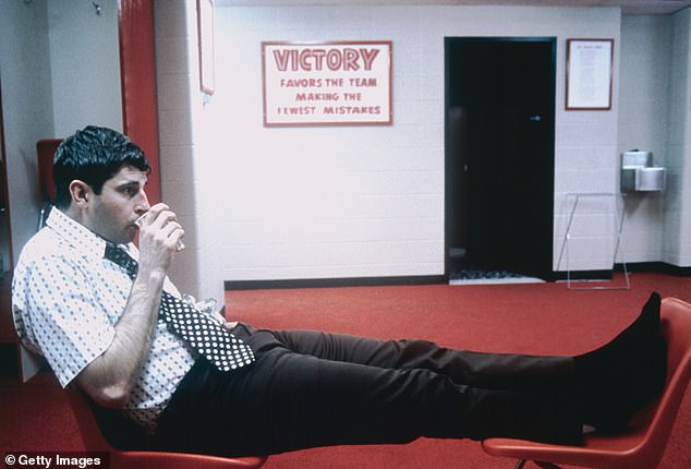 Indiana head coach Bob Knight sits in the locker room after facing Northwestern in 1973