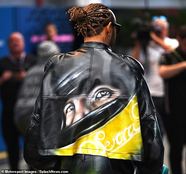 The Mercedes driver's jacket featured a visualization of Senna with a helmet on the back