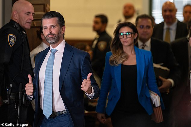 There were more thumbs up from Don Jr.  when he entered the court