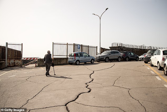 Nearly 10 earthquakes were detected around Campi Flegrei on Tuesday, but the quakes that struck on October 23 (pictured) caused roads in Pozzuoli to crack