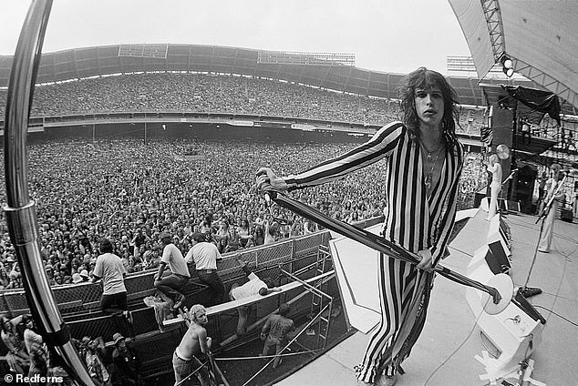 Aerosmith's Steven Tyler performs live on stage at RFK Stadium in Washington DC in 1976.  According to the lawsuit, Holcomb's relationship with him lasted from 1973 to 1976.