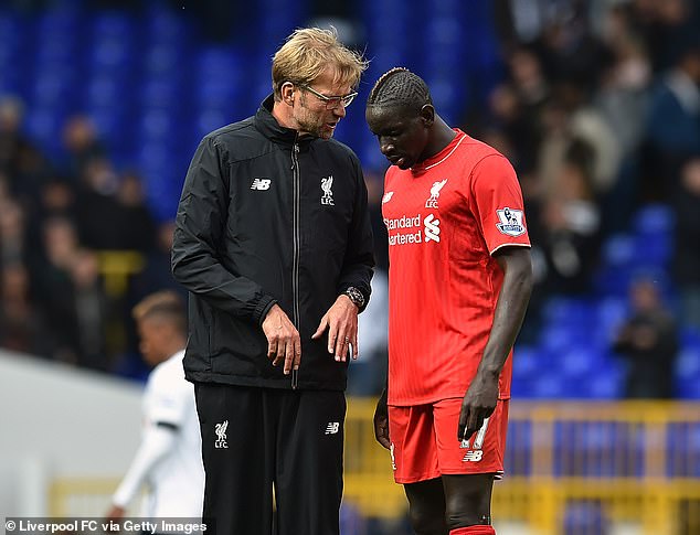 Sakho played eight years in the Premier League, including three and a half years with Jurgen Klopp (left) and Liverpool