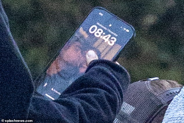 Cute: Although the couple was low-key about their relationship, Suki proudly showed her love when she had a photo of Robert kissing her on the lock screen of her iPhone