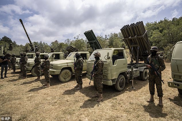 A file photo shows Hezbollah fighters with more primitive artillery.  The group has repeatedly exchanged fire with Israel in recent weeks