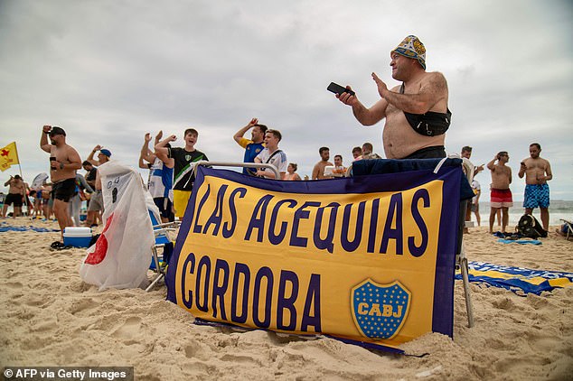 Fans appeared to be enjoying their afternoons on the beach before the brawl broke out - there is no indication the people pictured were involved