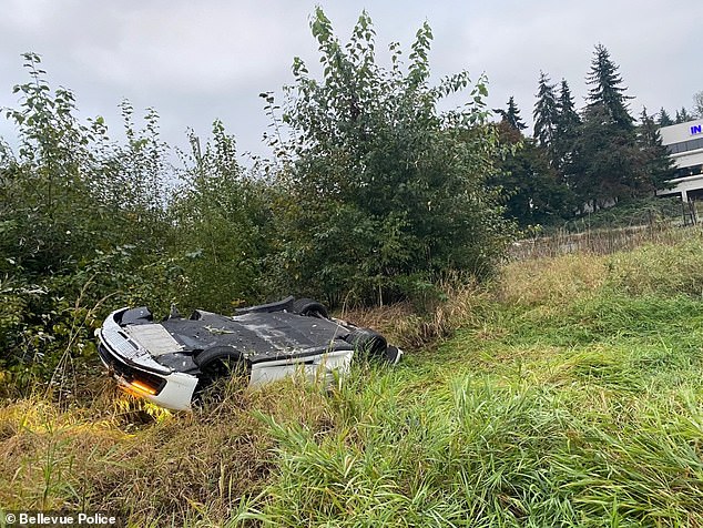 Pictured: The white sports car, believed to be driven by the Chinese woman, overturned and crashed after the collision