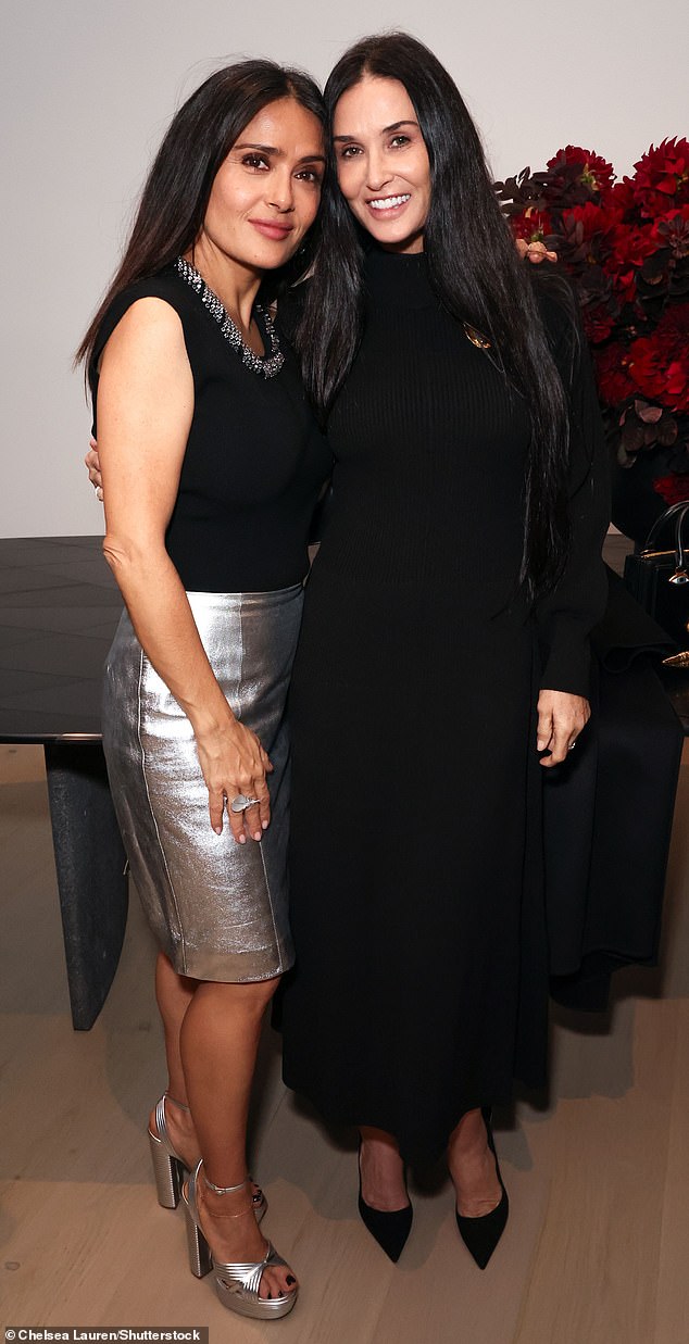 BFFs: Demi and Salma, 57, are old friends and seemed to have a happy reunion as they chatted and posed for photos at the event