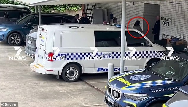 Erin Patterson enters the Wonthaggi police station, where she was charged with three counts of murder on Thursday