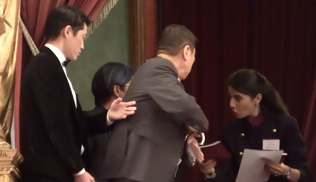 Nakajima was seen carrying an ornate walking stick as he was escorted to an exclusive casket at the Teatro Massimo