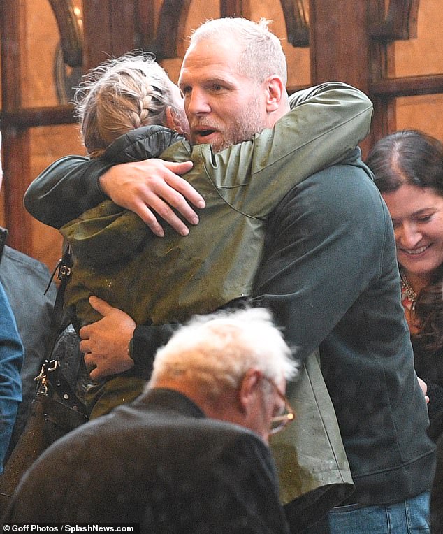 Hug: The former rugby player, 38, said a fond farewell to his female companion as he left the London Palladium on the second night of the tour with his friend Mike Tindall