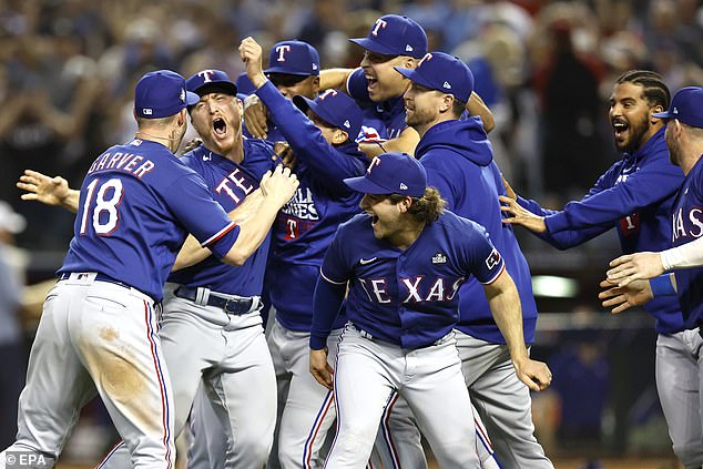 Texas Rangers players celebrate after the finale of Game 5 of the World Series