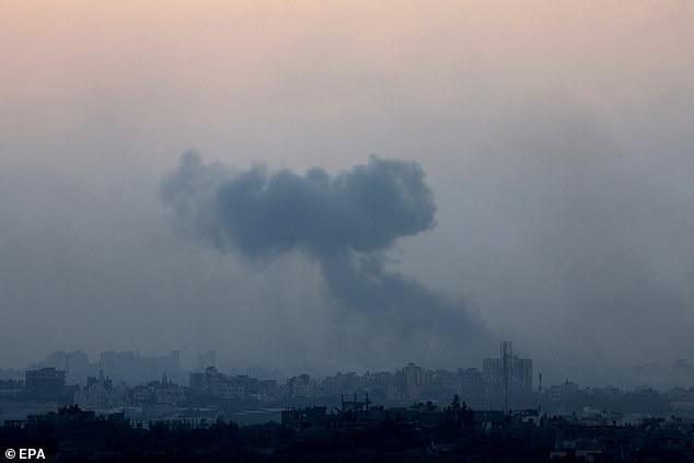 Hamas has claimed that dozens of Palestinians were killed and injured after an Israeli rocket attack hit an ambulance convoy.  Pictured: Smoke rising over Gaza City on November 3