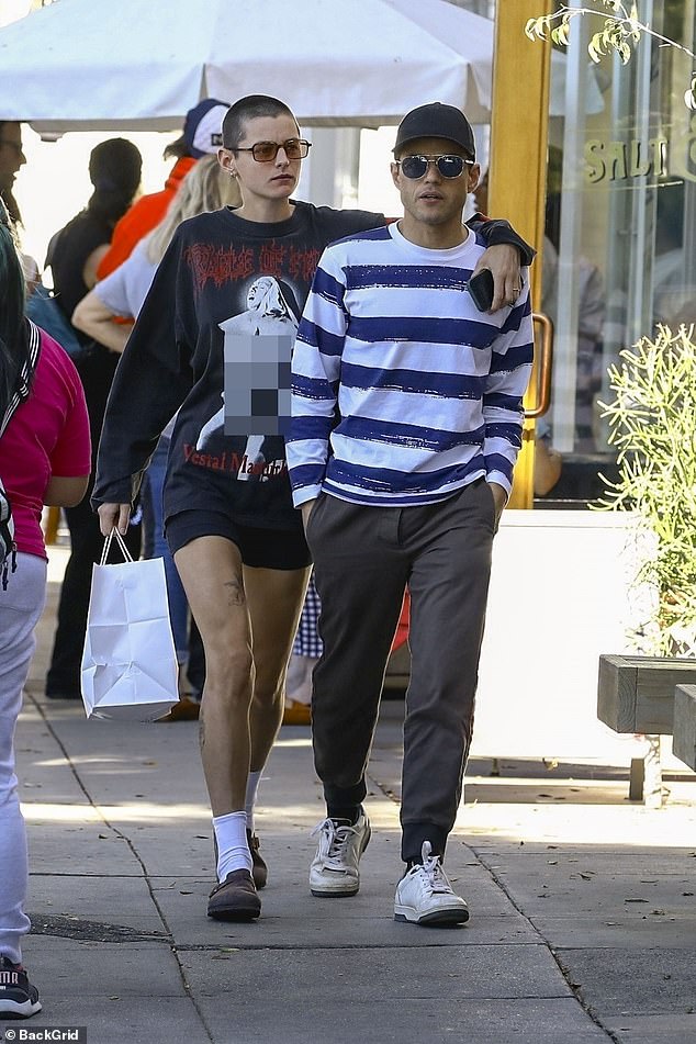 XOXO!  Emma – who came out as non-binary in 2021 – had their arms around Rami as they strolled down the boulevard at a leisurely pace