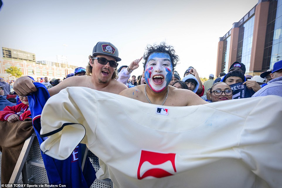 PROUD RANGER: A Rangers fan painted his face in the team's colors – white, blue and red – as he waited for the parade bus