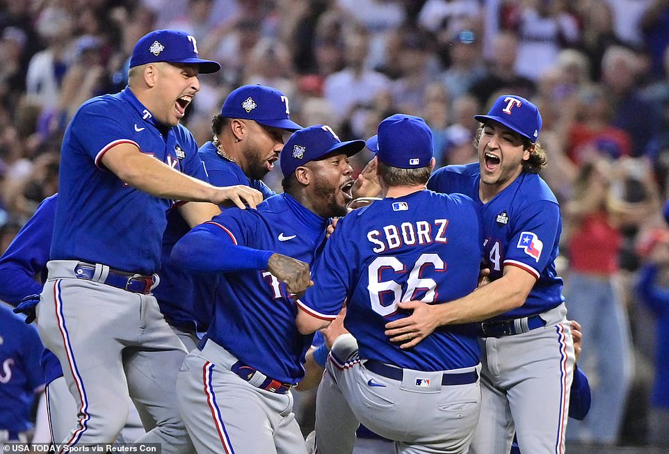 The Texas Rangers storm the field after beating the Arizona Diamondbacks to win the World Series in Game 5 on Wednesday