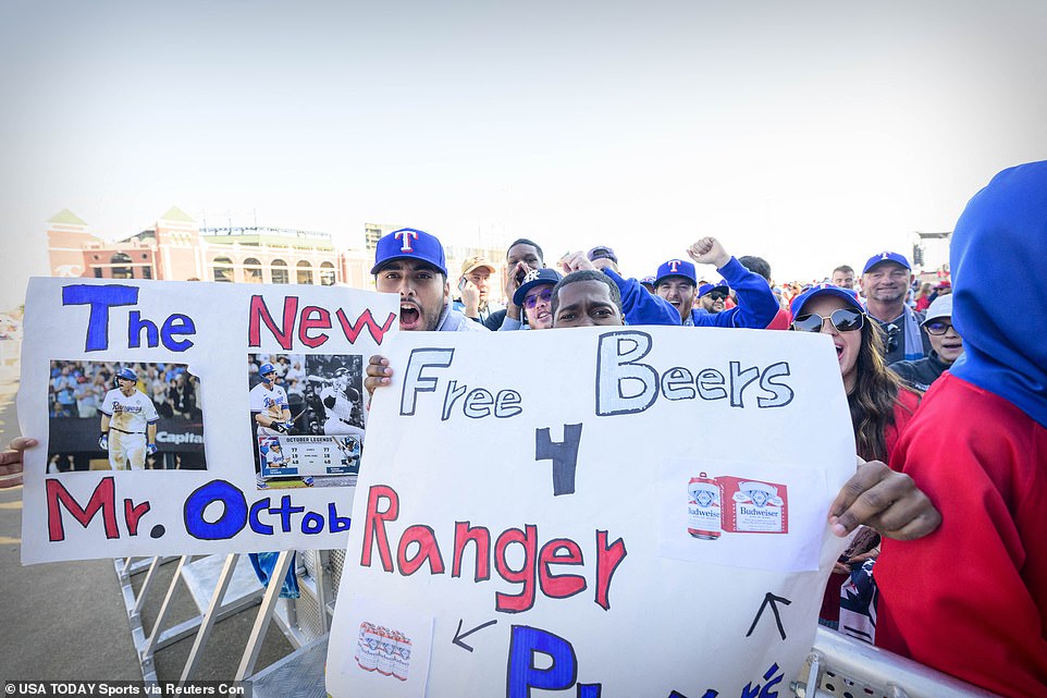 Several Texas Rangers fans brought posters to the parade asking for free beer to celebrate the occasion