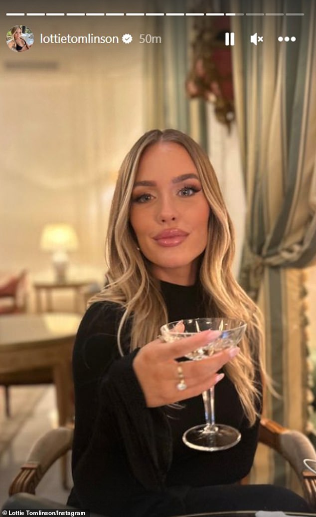 Lottie showed off her huge diamond ring as she enjoyed a glass of champagne