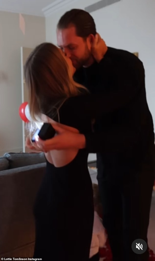 Sharing a video of the moment Lewis got down on one knee, Lottie captioned it: 'call me woman, I love you so much'